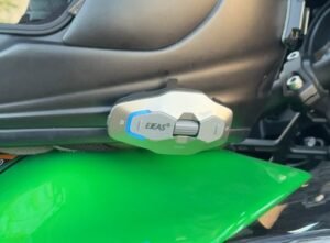 EJEAS X10 Plus intercom mounted on a motorcycle helmet during a real riding test